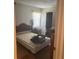 Modest bedroom featuring a bed, closet and dresser space perfect for rest and storage at 8409 Trionfo Ave, North Port, FL 34287