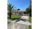 Charming one-story home with front lawn and walkway at 8409 Trionfo Ave, North Port, FL 34287