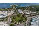 Aerial view of a town featuring a roundabout, shops, and a bridge over a bay at 1 Benjamin Franklin Dr # 93, Sarasota, FL 34236