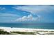 Beautiful beach view with blue skies, tranquil ocean, and pristine white sand at 1 Benjamin Franklin Dr # 93, Sarasota, FL 34236