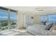 Bright bedroom featuring large windows and views of the city at 1 Benjamin Franklin Dr # 93, Sarasota, FL 34236
