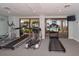 Fitness center showcasing modern treadmills and exercise equipment, offering a view of the pool at 1 Benjamin Franklin Dr # 93, Sarasota, FL 34236