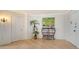 Inviting hallway with elegant decor and wood floors that lead to different parts of the home at 1 Benjamin Franklin Dr # 93, Sarasota, FL 34236