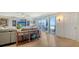 Comfortable living room with stylish furnishings and a sliding glass door to the outside balcony at 1 Benjamin Franklin Dr # 93, Sarasota, FL 34236