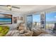 Inviting living room with ocean views from the balcony and comfortable seating arrangements at 1 Benjamin Franklin Dr # 93, Sarasota, FL 34236