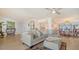 Open-concept living space with dining area, gourmet kitchen, and living room with ocean views at 1 Benjamin Franklin Dr # 93, Sarasota, FL 34236