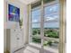 Bright living space with large windows and views of the surrounding greenery at 1 Benjamin Franklin Dr # 93, Sarasota, FL 34236