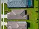 Aerial view of home with a tile roof and beautifully landscaped backyard at 10177 Crystal Isle Cir, Sarasota, FL 34241