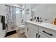 Bright bathroom with tub, white vanity, and modern black fixtures at 10177 Crystal Isle Cir, Sarasota, FL 34241