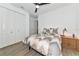 Light and airy bedroom with a ceiling fan, bed, and closet at 10177 Crystal Isle Cir, Sarasota, FL 34241