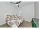 Bright bedroom features a ceiling fan, a comfy bed, and a window at 10177 Crystal Isle Cir, Sarasota, FL 34241