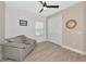 Inviting bedroom with ceiling fan, closet, and a comfortable chair at 10177 Crystal Isle Cir, Sarasota, FL 34241