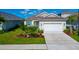 Attractive single-story home with well-manicured landscaping and a two-car garage at 10177 Crystal Isle Cir, Sarasota, FL 34241