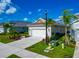 Well-maintained home exterior with lush landscaping and a two-car garage at 10177 Crystal Isle Cir, Sarasota, FL 34241