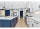 Spacious kitchen with white cabinets, stainless steel appliances, and a center island at 10177 Crystal Isle Cir, Sarasota, FL 34241