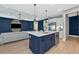 Bright, open kitchen with stainless appliances and center island open to the Gathering room at 10177 Crystal Isle Cir, Sarasota, FL 34241