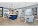 Bright kitchen featuring white cabinetry, a blue island, and stainless steel appliances at 10177 Crystal Isle Cir, Sarasota, FL 34241