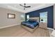 Well-lit primary bedroom with large bed, bedside tables, lamps, and attractive furnishings at 10177 Crystal Isle Cir, Sarasota, FL 34241
