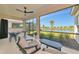 Spacious screened patio with seating area and serene water views at 10177 Crystal Isle Cir, Sarasota, FL 34241