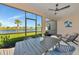 Relaxing screened patio with outdoor dining and beautiful lake views at 10177 Crystal Isle Cir, Sarasota, FL 34241