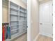 Organized walk-in closet features custom shelving, drawers, and ample storage space at 10177 Crystal Isle Cir, Sarasota, FL 34241