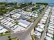 Wide aerial shot showcasing a well-maintained mobile home community with tidy streets and convenient access to the water at 10315 Cortez W Rd # 60-4, Bradenton, FL 34210