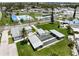 Overhead view of community amenities including a pool, tennis courts, and a shuffleboard court, perfect for recreation at 10315 Cortez W Rd # 60-4, Bradenton, FL 34210