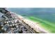 Beautiful aerial view of the coastline with houses, a sandy beach, and the clear ocean at 10315 Cortez W Rd # 60-4, Bradenton, FL 34210