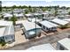 Overhead view of residences shows tidy lots with attractive landscaping and nearby parking, creating a welcoming neighborhood at 10315 Cortez W Rd # 60-4, Bradenton, FL 34210