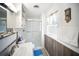Bathroom has a shower with glass doors and a white vanity at 10315 Cortez W Rd # 60-4, Bradenton, FL 34210