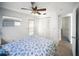 Bedroom has a ceiling fan and a closet at 10315 Cortez W Rd # 60-4, Bradenton, FL 34210