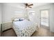 Well-lit bedroom features a ceiling fan and matching nightstands at 10315 Cortez W Rd # 60-4, Bradenton, FL 34210