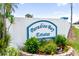 Welcome to Paradise Bay Estates, a beautiful community as displayed on this sign surrounded by lush greenery and flowers at 10315 Cortez W Rd # 60-4, Bradenton, FL 34210