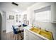 Eat-in kitchen features a glass dining table and a yellow sink at 10315 Cortez W Rd # 60-4, Bradenton, FL 34210