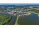 Discover waterfront living with this aerial view of real estate on a serene lake at 10571 Old Grove Cir, Bradenton, FL 34212