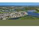 A bird's eye view of homes surrounded by lush greenery, lakes, and golf courses at 10571 Old Grove Cir, Bradenton, FL 34212