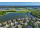 An aerial shot of homes nestled on the water, providing stunning waterfront real estate at 10571 Old Grove Cir, Bradenton, FL 34212