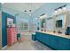 Bright bathroom features double sinks, tub and a big window for natural light at 10571 Old Grove Cir, Bradenton, FL 34212
