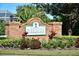 Brick sign for Greenfield Plantation, a golf course community with lush landscaping at 10571 Old Grove Cir, Bradenton, FL 34212