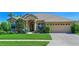Charming single-Gathering home featuring a manicured lawn and inviting curb appeal, ideal for comfortable living at 10571 Old Grove Cir, Bradenton, FL 34212