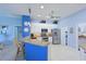Bright kitchen with bar seating, stainless steel appliances, and white cabinets at 10571 Old Grove Cir, Bradenton, FL 34212