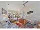 Cozy living room features comfortable seating, a colorful rug, and stylish decor that create a welcoming atmosphere at 10571 Old Grove Cir, Bradenton, FL 34212