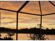 Enjoy serene lake views from the screened lanai, perfect for relaxation and enjoying the tranquil sunset at 10571 Old Grove Cir, Bradenton, FL 34212