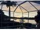 Enjoy the sunsets from this tranquil outdoor space featuring a screened patio with views of the lake at 10571 Old Grove Cir, Bradenton, FL 34212