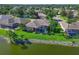 Beautiful home on a lake, featuring a screened lanai with a pool for ultimate outdoor enjoyment and privacy at 10571 Old Grove Cir, Bradenton, FL 34212