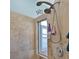 Shower with multi-setting showerhead and tiled surround at 10571 Old Grove Cir, Bradenton, FL 34212