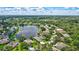 Beautiful aerial view of a lakeside community showcasing lush green landscaping and well-maintained homes at 11250 Rivers Bluff Cir, Lakewood Ranch, FL 34202