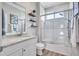 Bathroom features a white vanity with granite countertop and a glass-enclosed shower at 11250 Rivers Bluff Cir, Lakewood Ranch, FL 34202