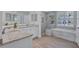 Modern bathroom featuring double sinks, granite countertops, a tub, and a glass-enclosed shower at 11250 Rivers Bluff Cir, Lakewood Ranch, FL 34202