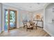 Dining area features decorative glass front door, pendant lighting, and modern décor at 11250 Rivers Bluff Cir, Lakewood Ranch, FL 34202